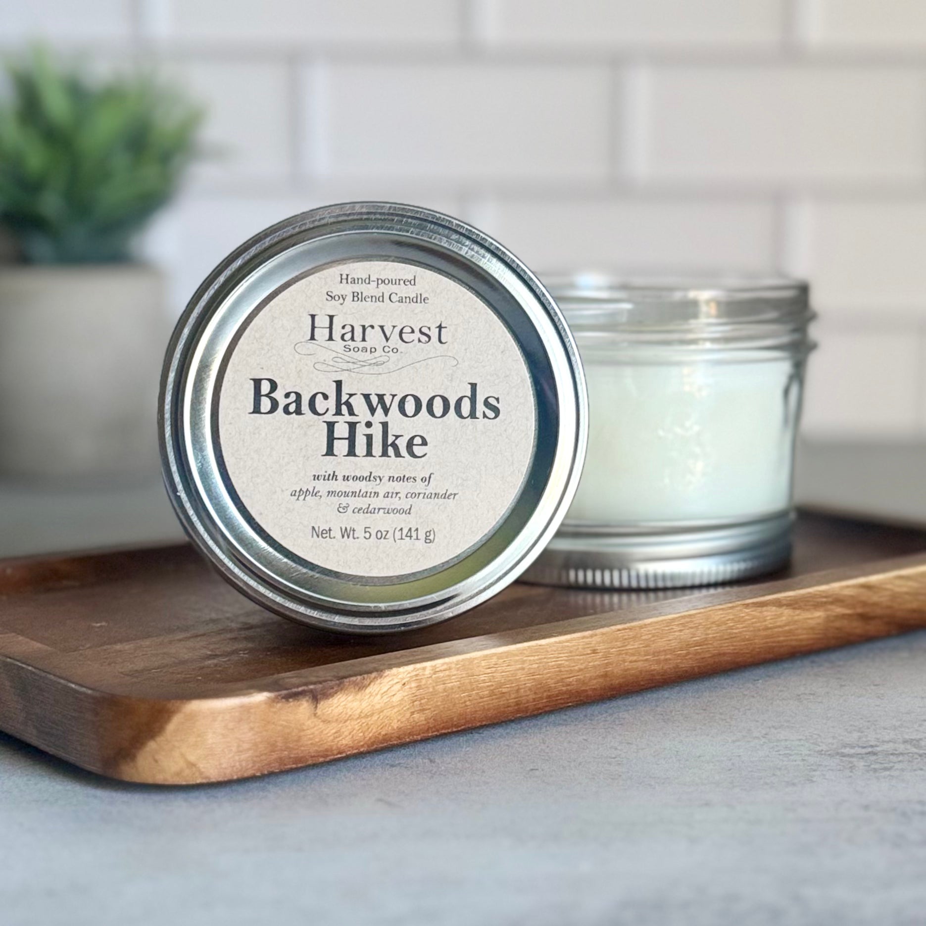 Backwoods Hike Candle from Harvest Soap Company, showing a rustic candle with natural wood-inspired design and warm, earthy tones.