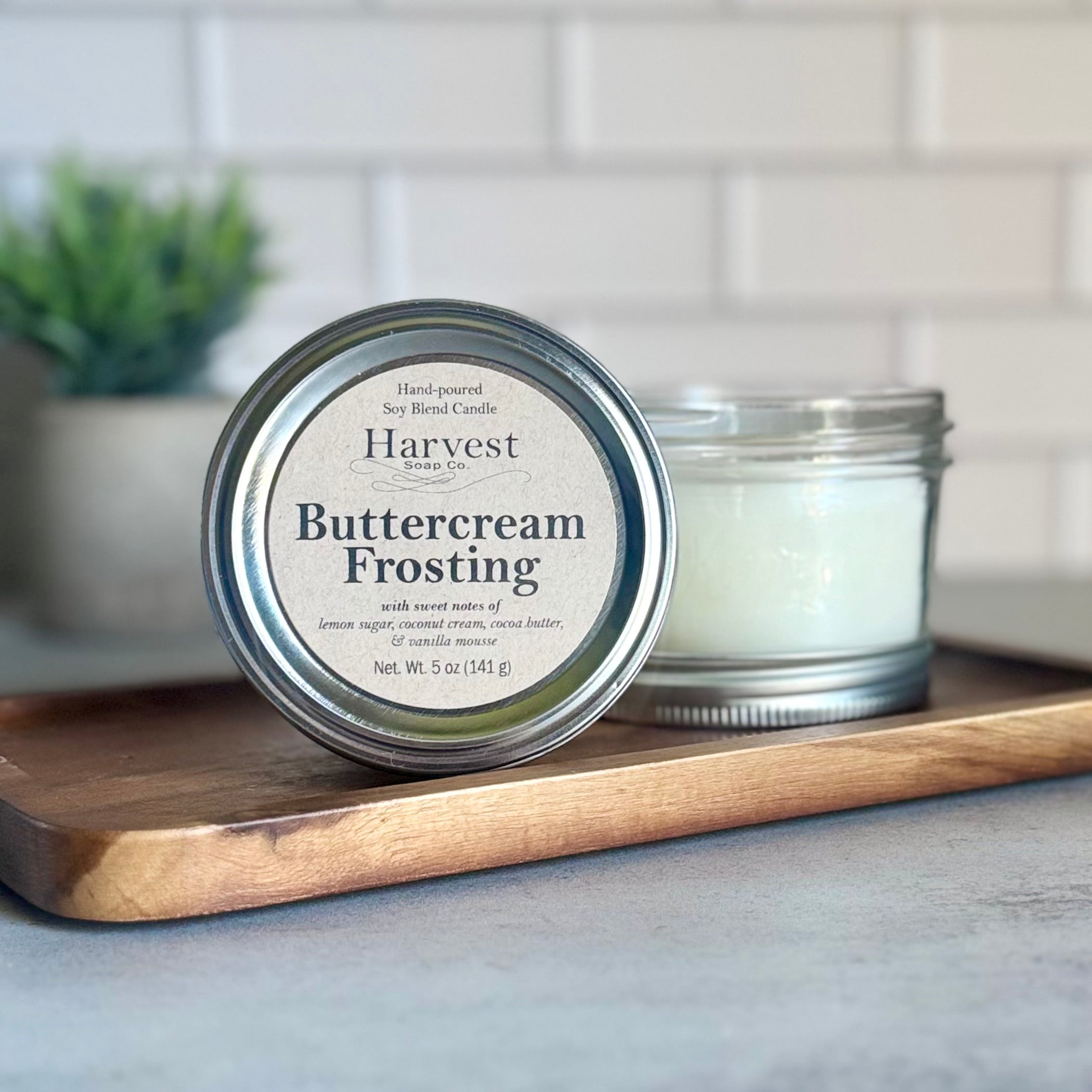 Harvest Soap Company buttercream frosting candle with realistic cream-colored wax and decorative frosting-like top.