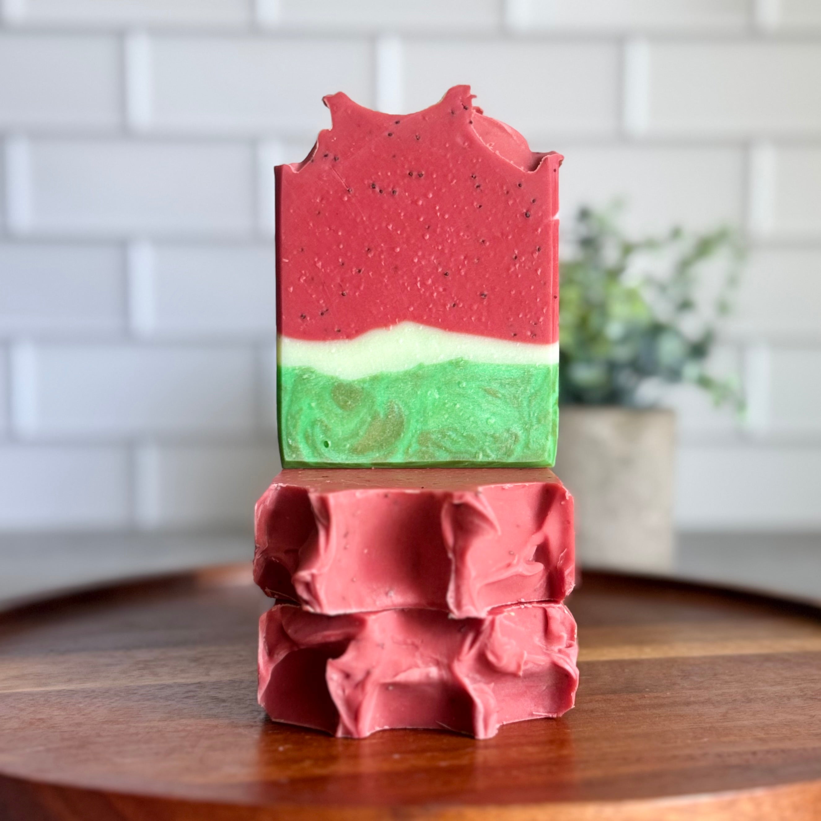 Juicy Watermelon artisan bar soap by Harvest Soap Company featuring vibrant watermelon imagery and a fresh, fruity appearance.