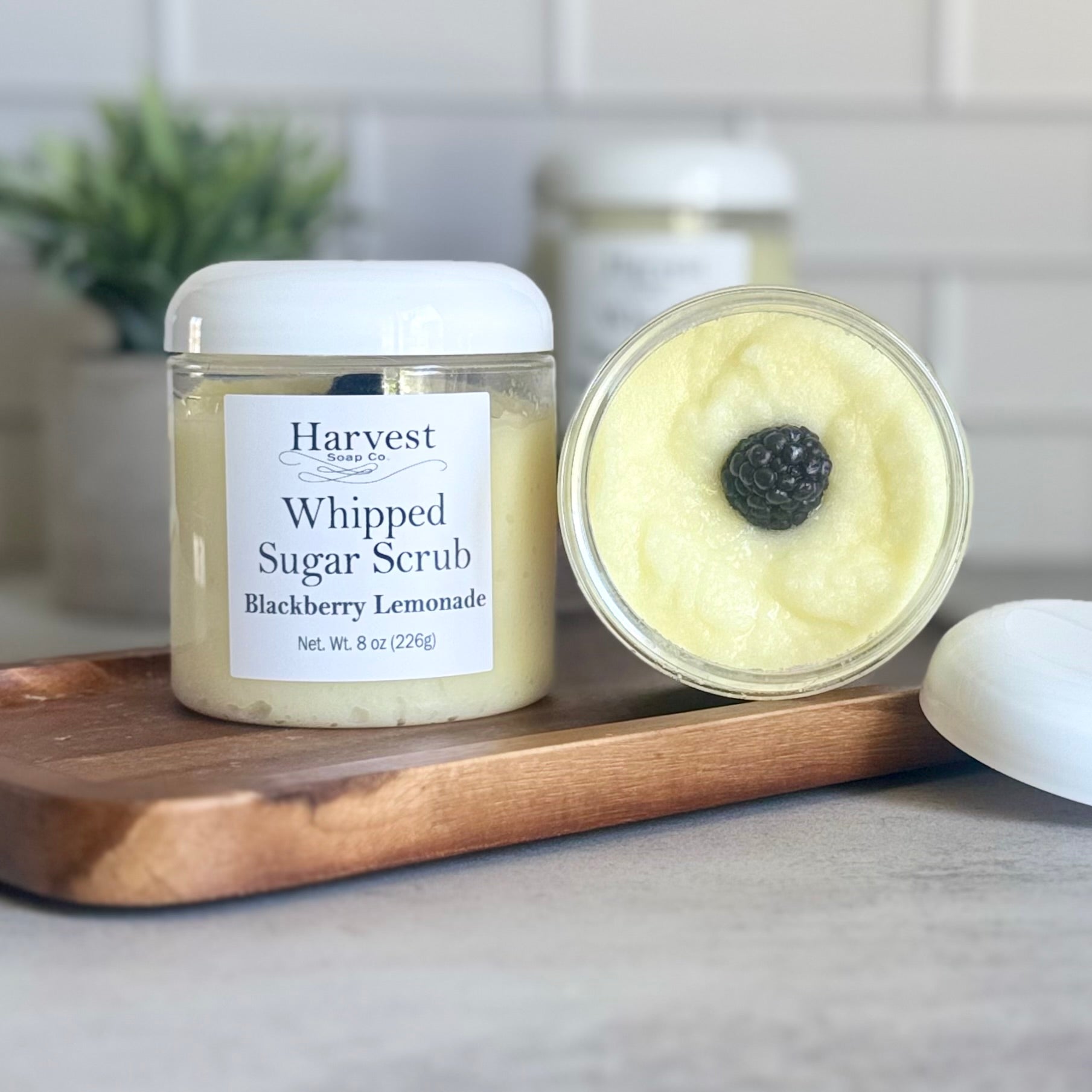 Blackberry Lemonade Whipped Sugar Scrub by Harvest Soap Company showing fluffy, whipped sugar scrub with blackberry and lemon scent.