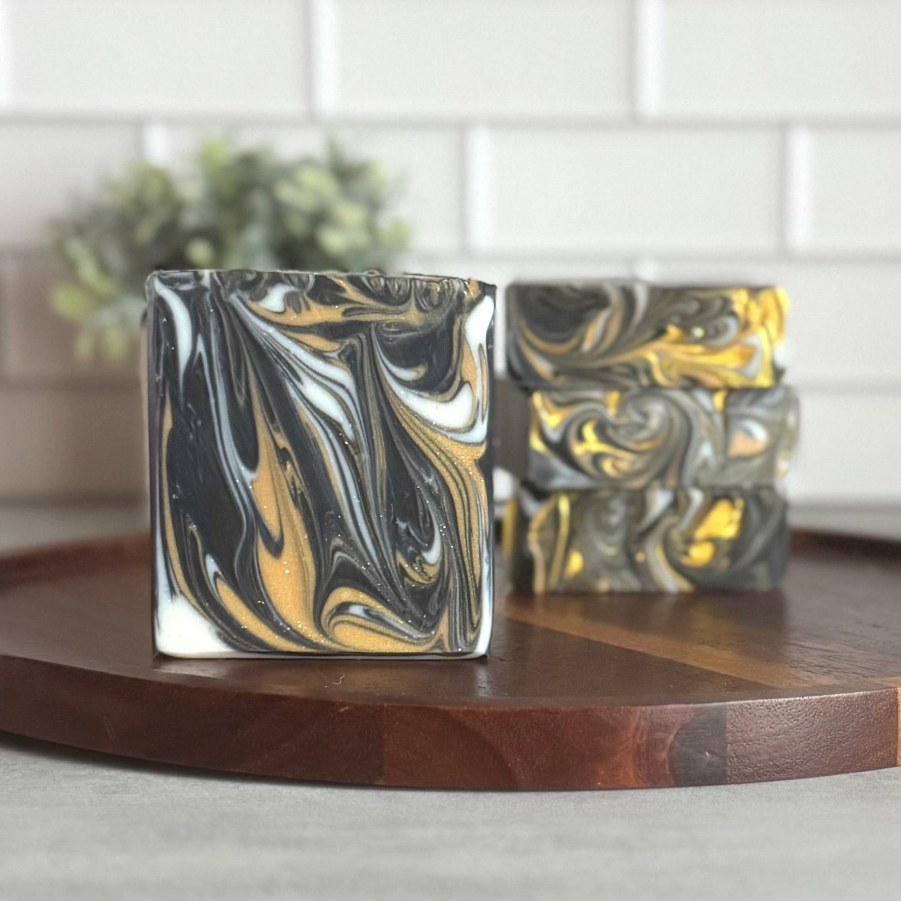 midnight rendezvous handmade soap with masculine scent and black, white, and gold swirls